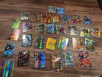 All loose holographic Pokémon EX cards spread on floor