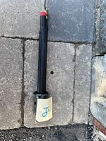 Full view of torch head showing handle and capped fittings