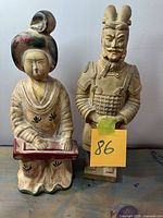 Front view of both figurines side by side