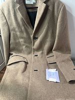 Front view of camel overcoat showing overall design