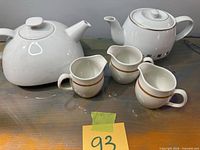 Top view showing both teapots and creamer