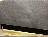 Gray upholstered headboard front view