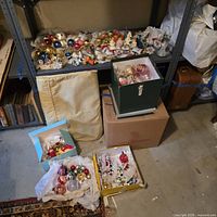 Shelf and floor boxes filled with assorted ornaments