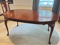 Overall view of oval dining table with leaf inserted