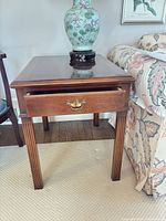 Full view of end table with drawer open, shows top, drawer, legs