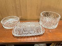 Three of the four Waterford crystal dishes displayed on shelf