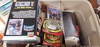 Overview of bin showing Marvel boxed set, three Star Wars Micro Machines sets, Austin Powers case