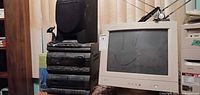 Stacked Sony stereo components with speaker and IBM CRT monitor