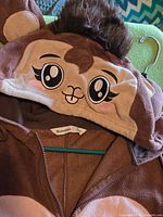 Hood showing embroidered monkey face, 3-D ears, faux-fur tuft, Bluenotes label