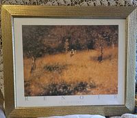 Front view showing Renoir print, mat and gold frame
