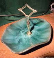 Top view of green handled plate