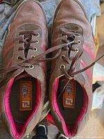Top view of both shoes showing uppers, laces and FootJoy insole logo