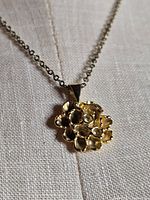 Pendant and chain overall view on fabric