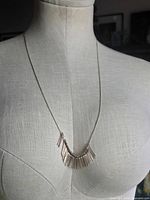 Full view of necklace on mannequin form
