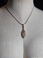 Full view of necklace on display form