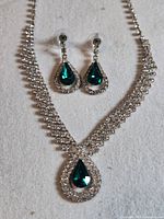 Full view of rhinestone necklace and matching earrings set