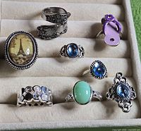 Tray showing all eight silver-tone rings