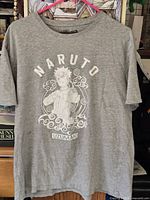 Front view of grey Naruto graphic T-shirt on hanger