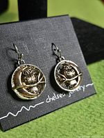 Front view of both owl earrings on display card