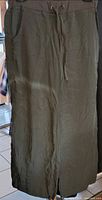 Front view olive green capri pants hanging