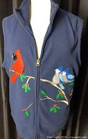 Full front view of navy vest showing cardinal and bluebird appliqué