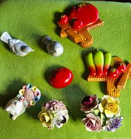 Group view of all eight items laid out on green fabric