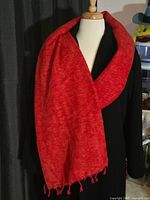 Scarf draped on mannequin showing color and width