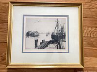 Framed etching with mat and frame visible