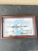 Overall view of framed commemorative plaque