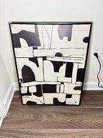 Front view of framed abstract canvas