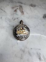 Front view showing locomotive design and silver-tone case