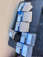 Six packaged curtain panels on table