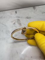 Full view of bangle showing crystals and padlock charm