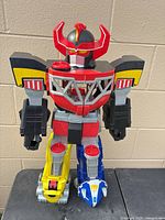 Front view of full Megazord figure standing on table
