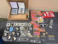 Overall lot with medals, patches, name tapes, pins
