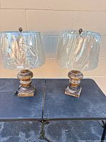 Both table lamps side by side on table showing overall condition