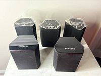 Five hexagonal Samsung speakers front/top view