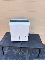 Front and top view of Seasons dehumidifier showing overall form and condition