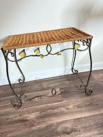 Full view of wicker top bench with metal frame