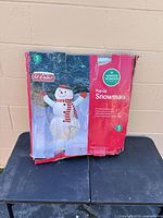 Retail box showing Winter Wonder Lane 5 ft Pop-up Snowman, box torn