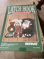Front of sealed Bernat Santa Express latch hook kit box