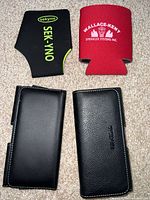 Front view of two phone holsters with two koozies