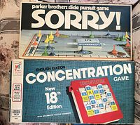 Top view of Sorry! and Concentration game boxes