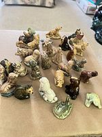 Group of small glazed animal figurines on table