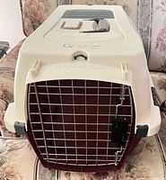 Front angle showing wire door, cream top, maroon base