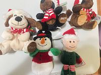 Group shot of all five Sears holiday plush figures