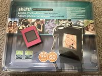 Front of sealed package showing pink keychain device, capacity graphic, branding