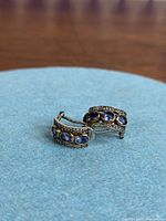 Front view of both earrings showing stones and design