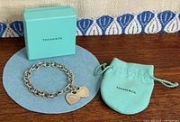 Bracelet, box and pouch displayed together