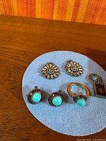 Overall view of all jewelry pieces on felt pad